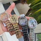 Guess G Twist Diamonds Rose Gold Dial Rose Gold Steel Strap Watch For Women - W1201L3 Authentic Buy Shop Now