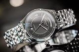 Tissot T Classic T One Automatic Black Dial Silver Steel Strap Watch For Men - T038.430.11.057.00 Authentic Buy Shop Now